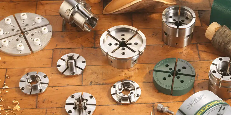 Assorted metal lathe chucks.